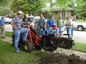 the Plano Irrigation Repair team brings in the big trencher to make quick work of an install